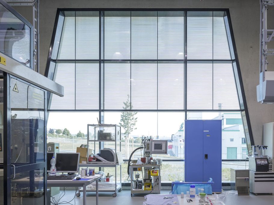 Fraunhofer-Zentrum, Bayreuth, Germany Modern laboratory interior with large windows, equipment, and a blue storage unit.