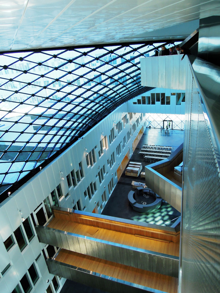 Statoil AHA HQ, Oslo, Norway Modern interior with sleek metal and glass design, featuring open spaces and natural light.