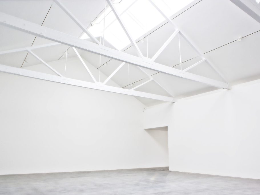 Newport Street Gallery, London Spacious, empty gallery with white walls and a bright skylight.