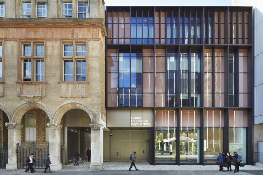 Central Foundation Boys School, London Modern building with glass façade adjacent to a historic stone structure.
