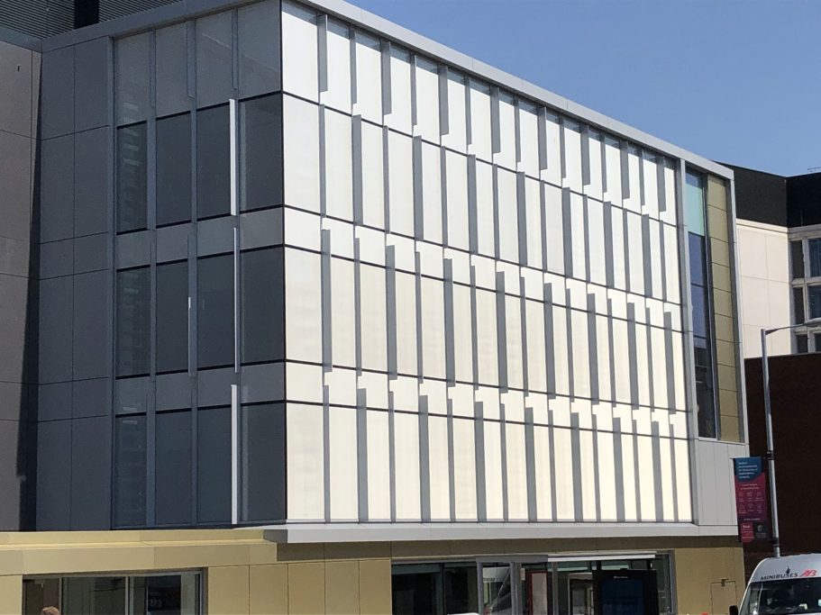 University of Bedfordshire Modern building featuring a glass façade and a sleek, minimalist design.